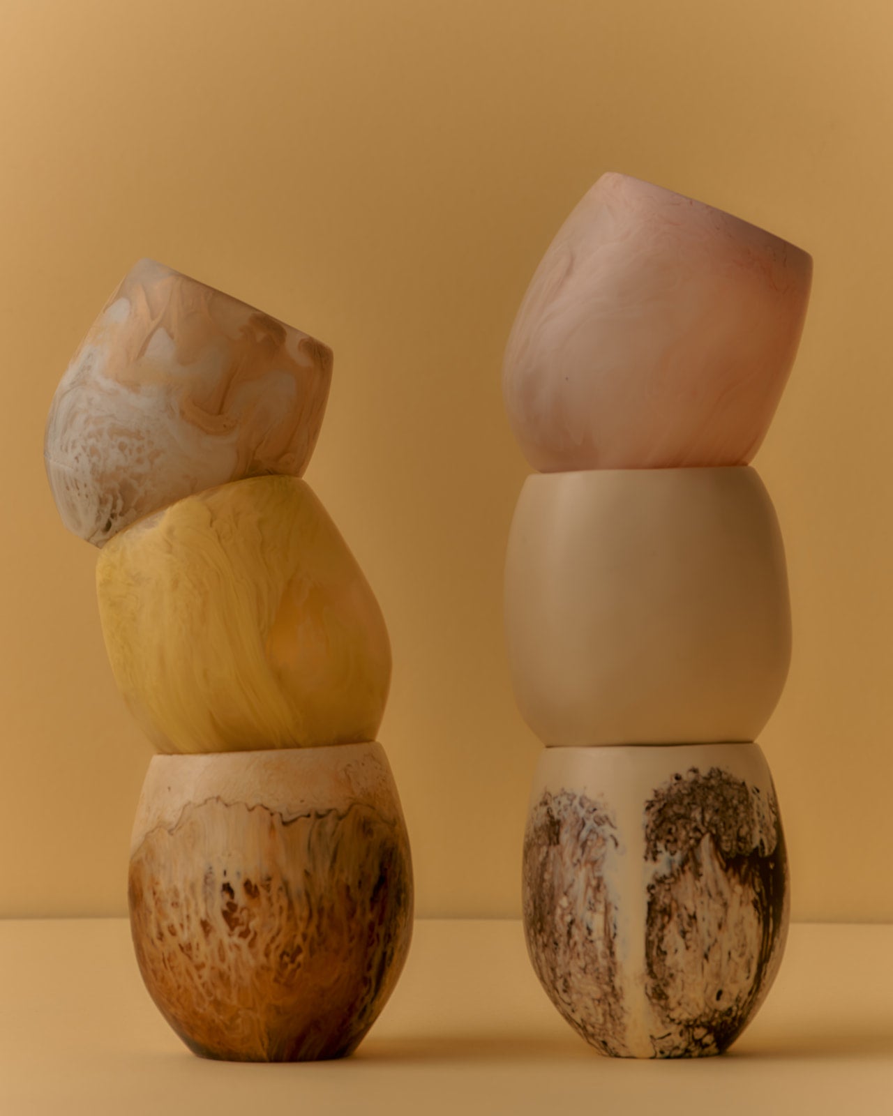 Variety of drinking cups in pinks and browns