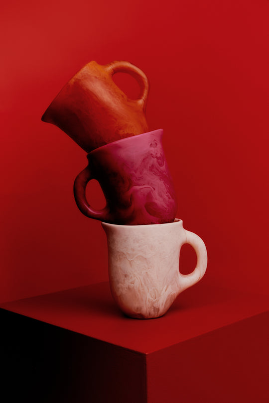 Stacked carafe's in pink tones
