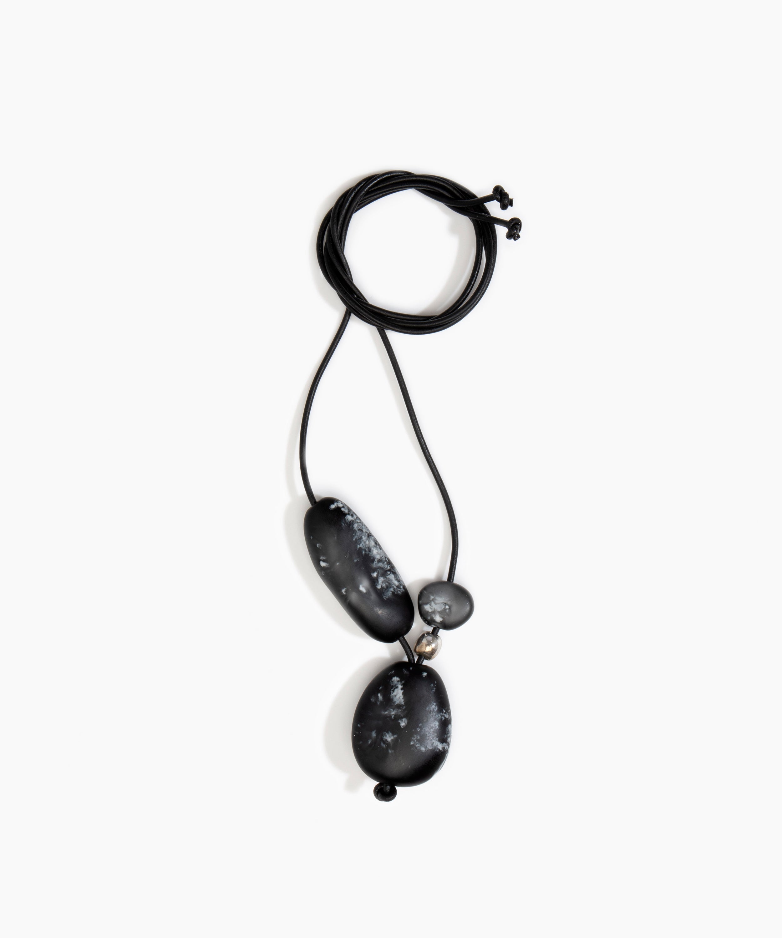Dinosaur Designs Rock Cluster Pendant in Black Marble Colour resin with Nano-Coated Brass Bead Material.