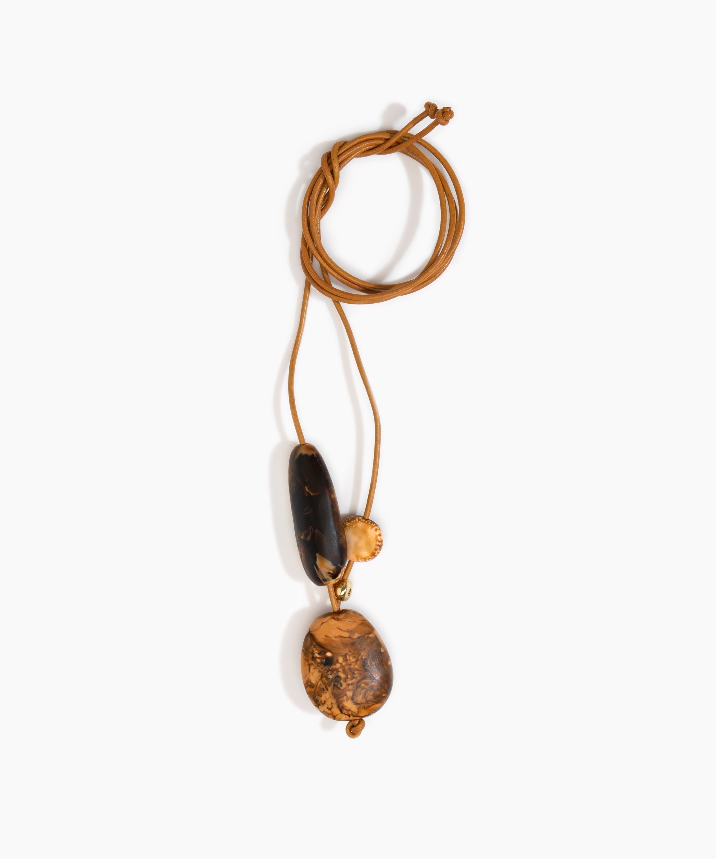 Dinosaur Designs Rock Cluster Pendant in Dark Horn Colour resin with Nano-Coated Brass Bead Material.