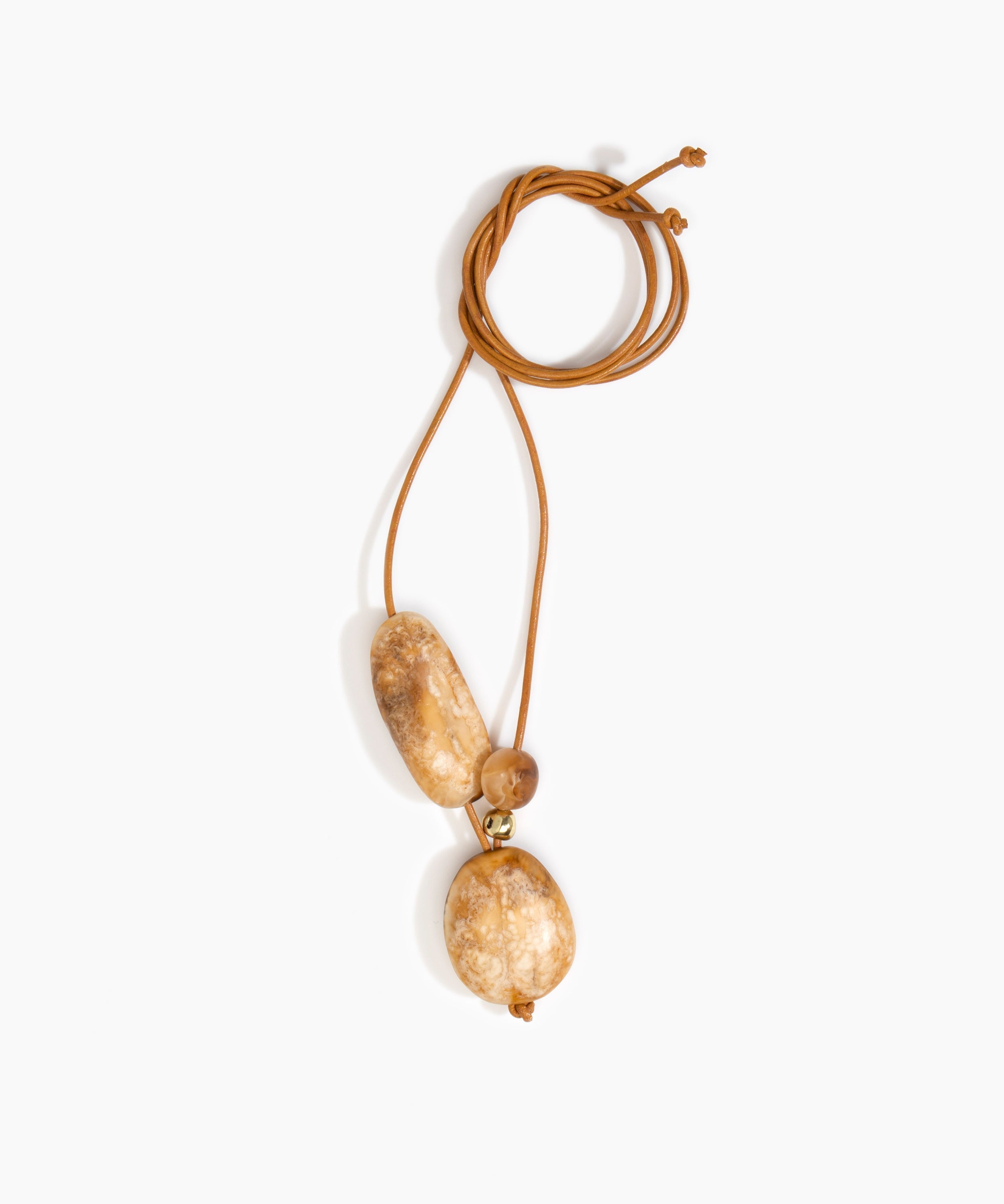 Dinosaur Designs Rock Cluster Pendant in Light Horn Colour resin with Nano-Coated Brass Bead Material.