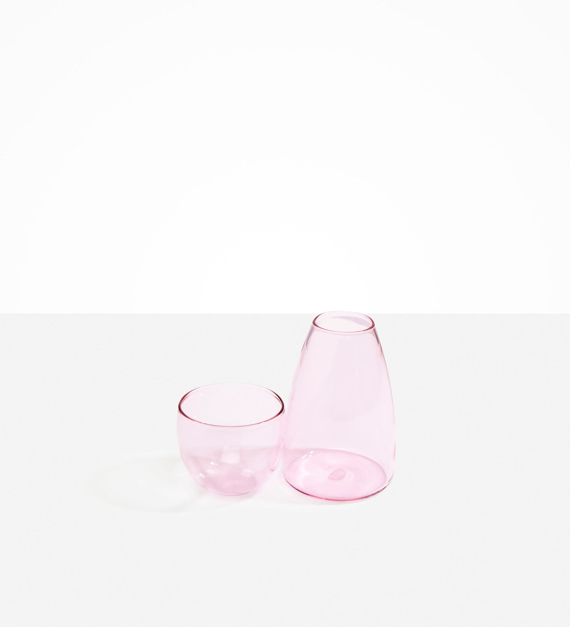 Dinosaur Designs coloured Glass Pebble Carafe cup and jug set in transparent pink.