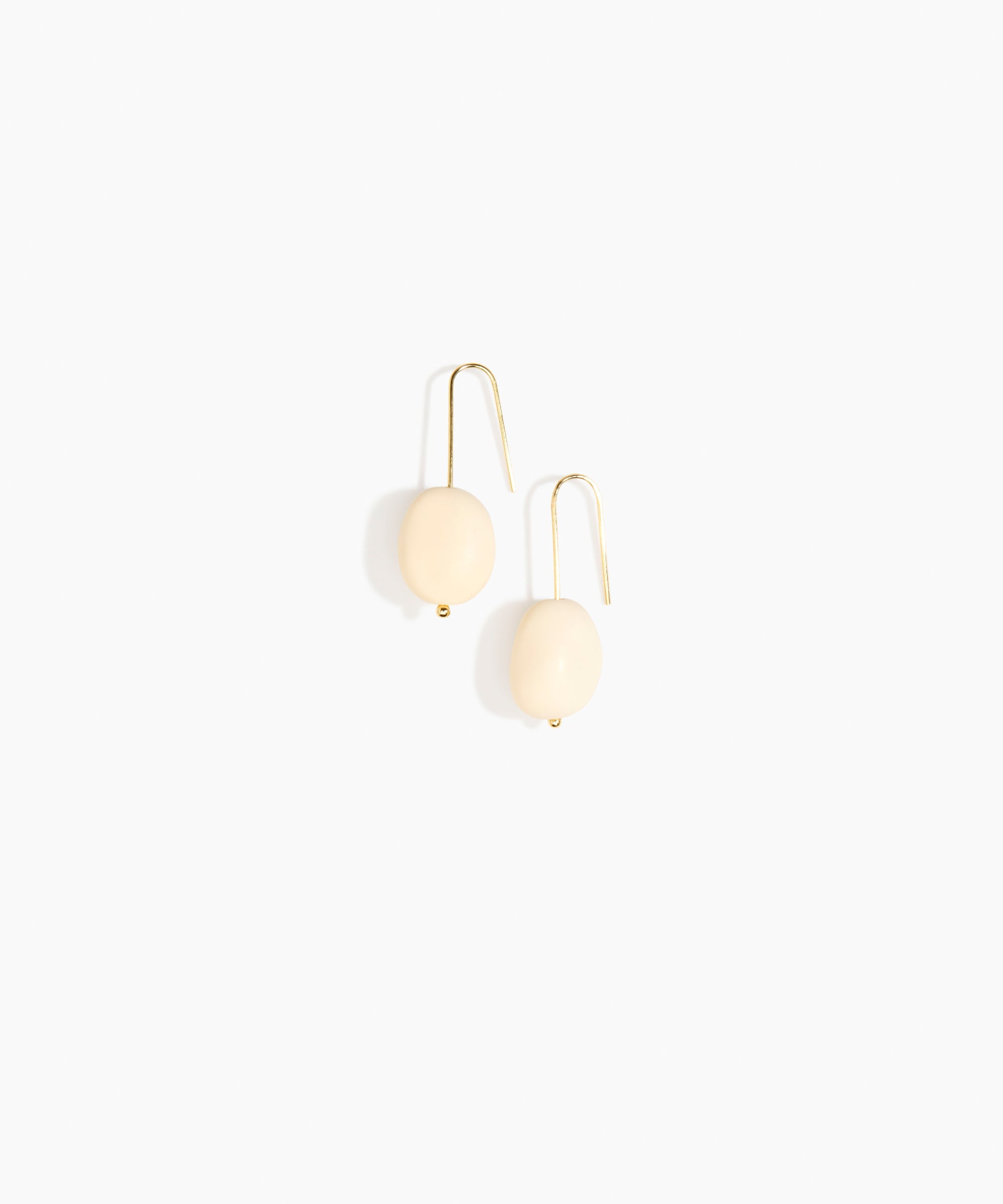 Dinosaur Designs Earth Wire Earrings in Cream Colour resin with Gold-Filled Material.