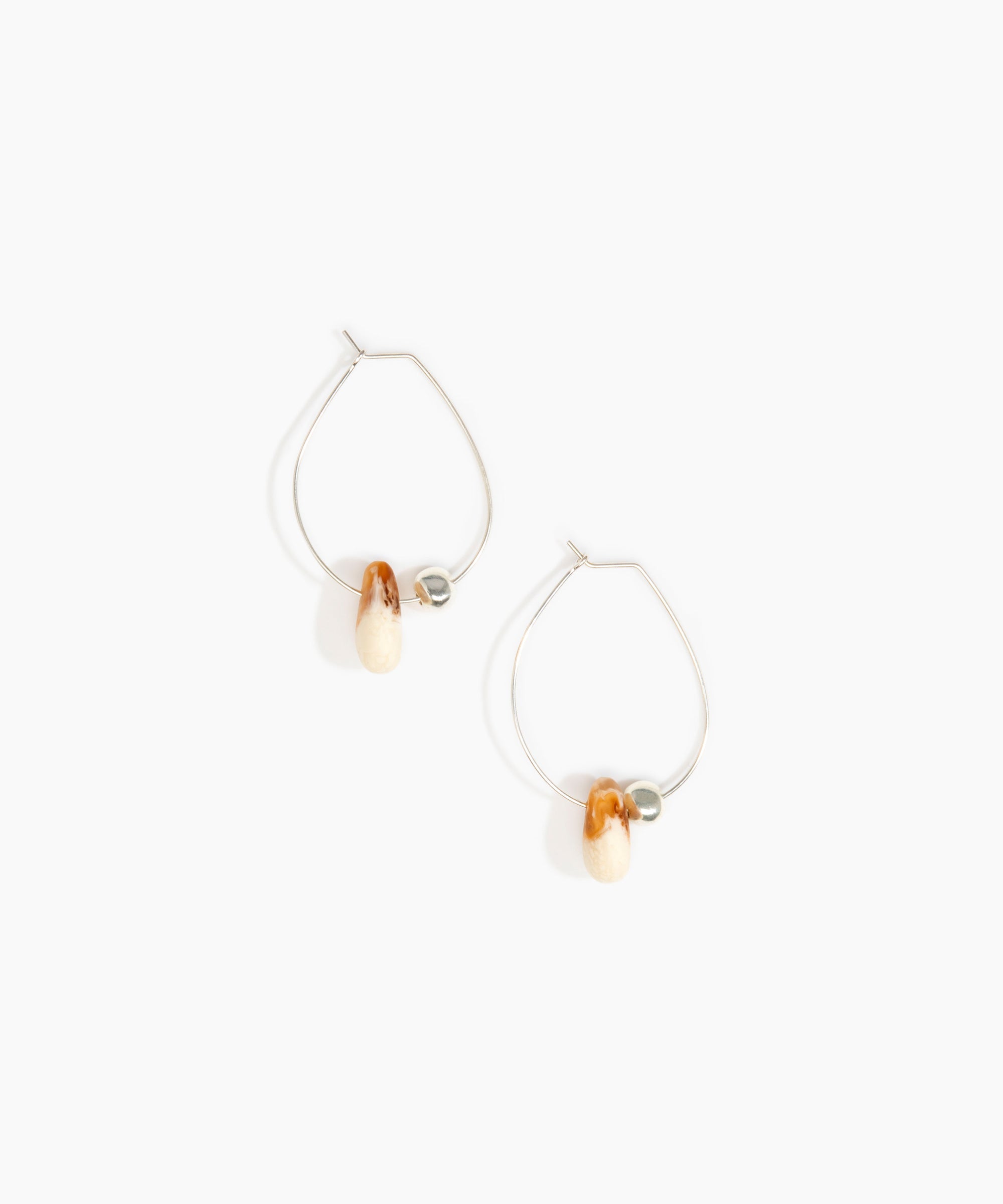 Dinosaur Designs Joie De Vivre Hoop Earrings in Light Horn Colour resin with 925 Sterling Silver Material.