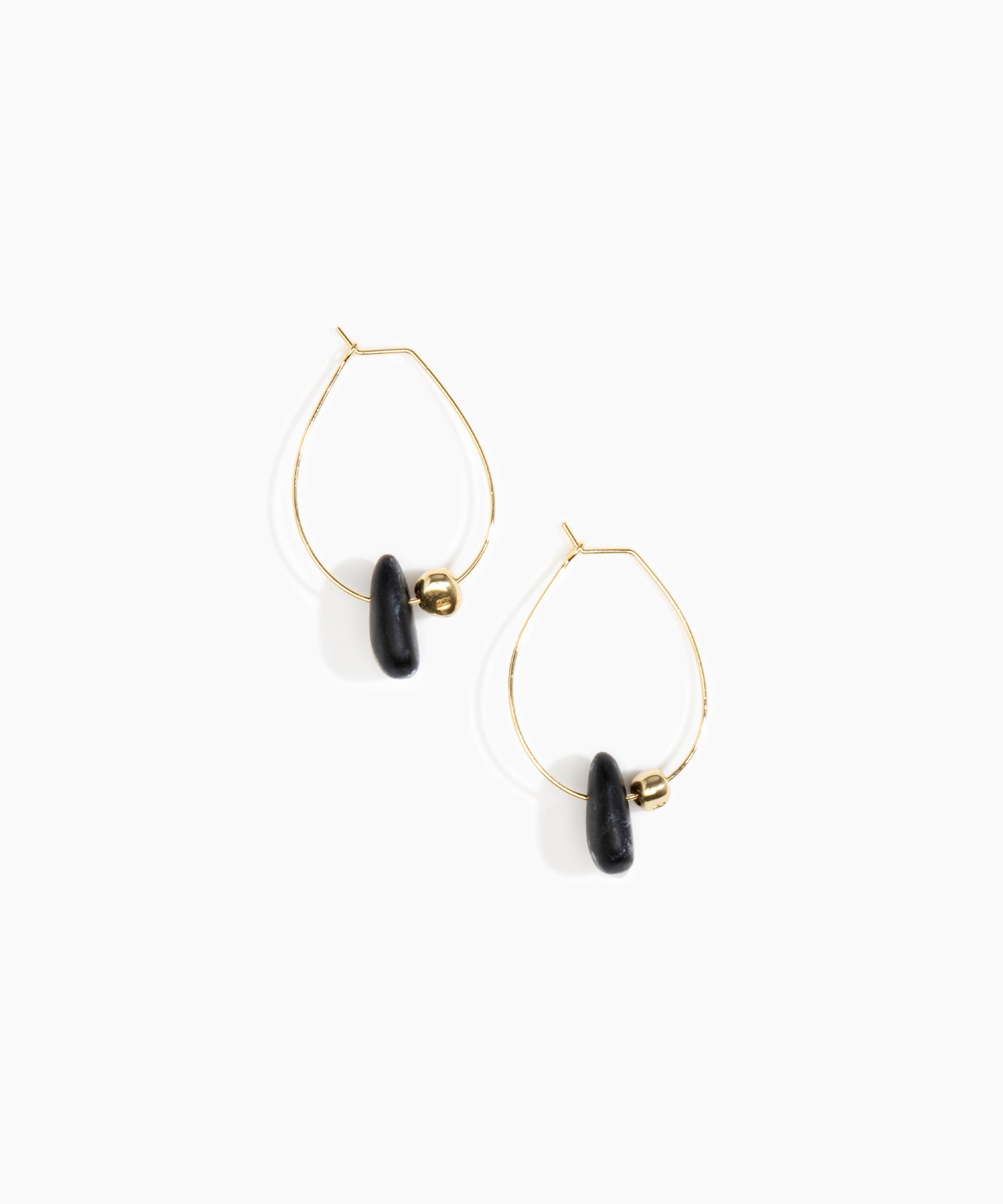 Dinosaur Designs Joie De Vivre Hoop Earrings in Black Marble Colour resin with Gold-Filled Material.