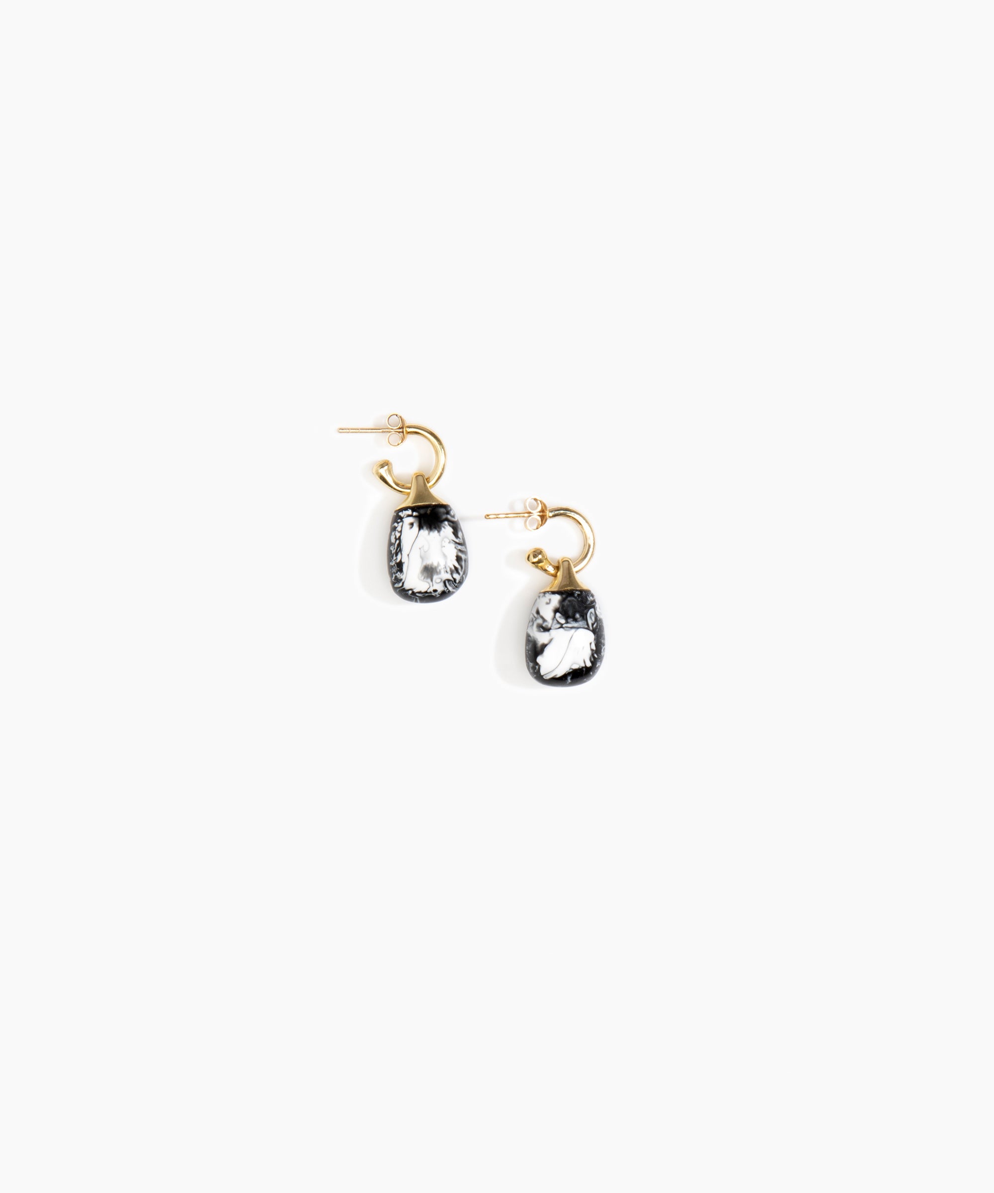 Dinosaur Designs Small River Rock Hoop Earrings in Black Marble Colour resin with Brass Hoop Material.