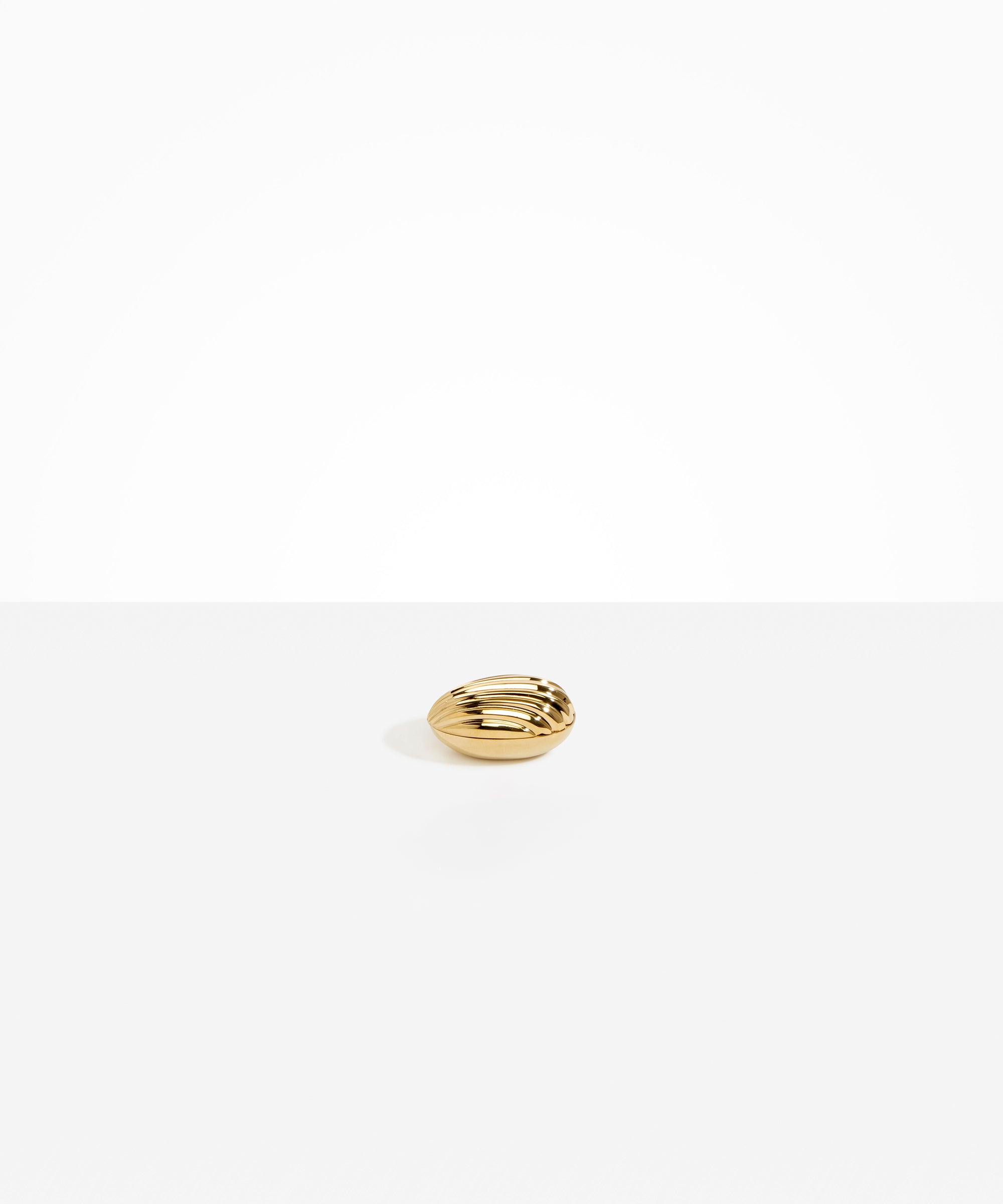 Corey Ashford Madeleine Jar in Brass Material.