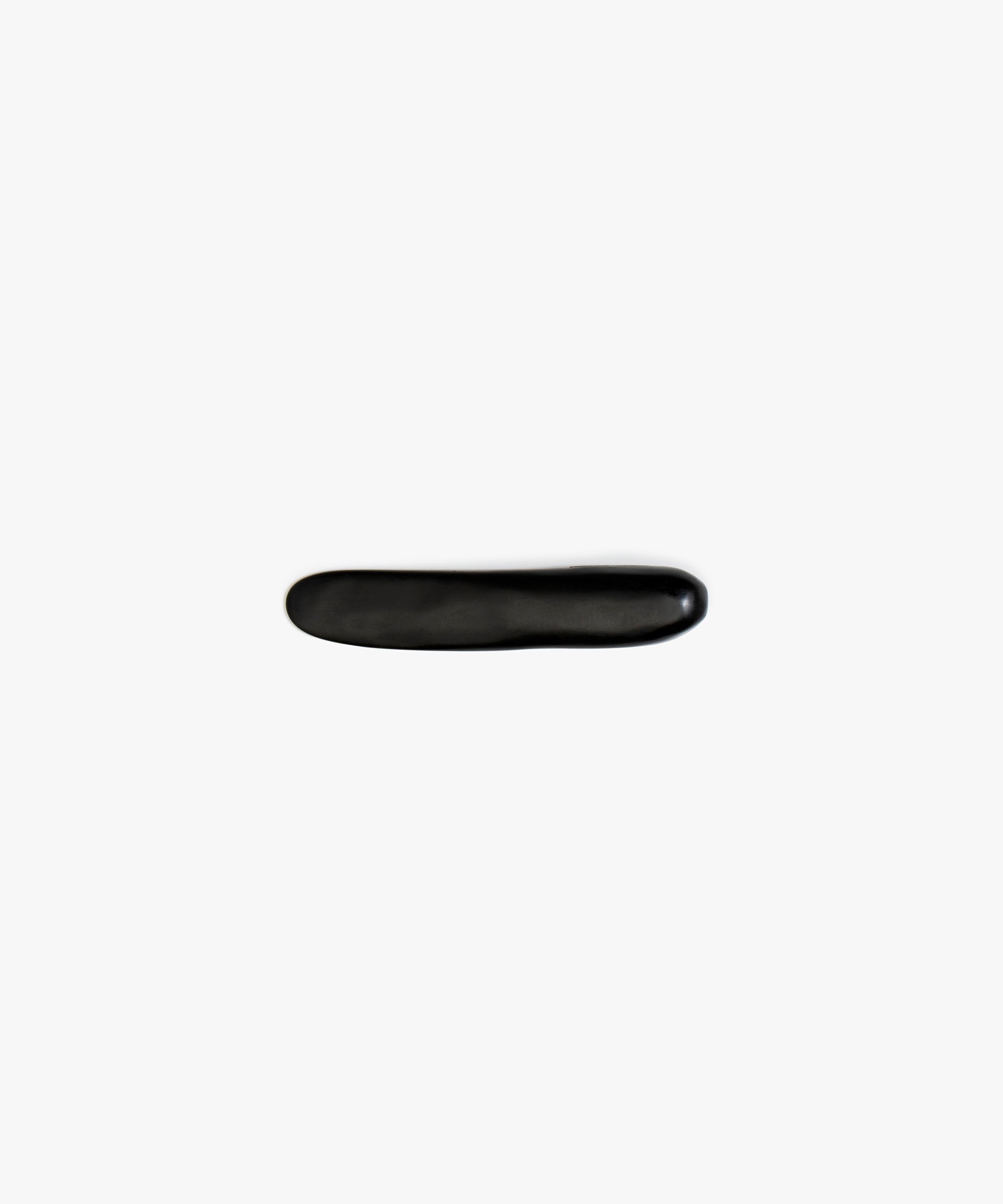 Dinosaur Designs Stone Butter Knife in Black Colour resin.