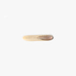 Dinosaur Designs Stone Butter Knife in Sandy Pearl Colour resin.
