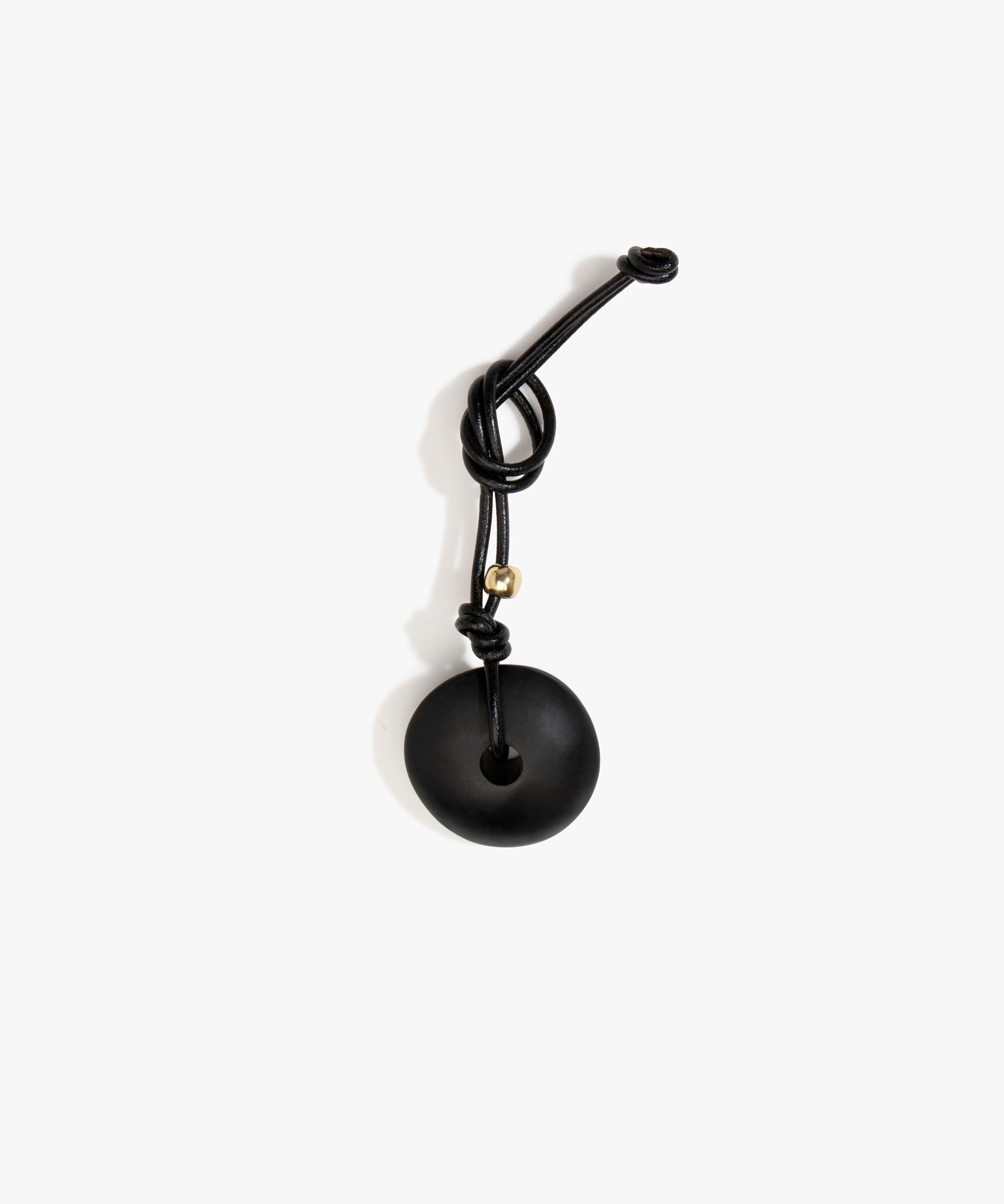 Dinosaur Designs Flat Watercolour Bag Charm in Black Colour resin with Brass Material..