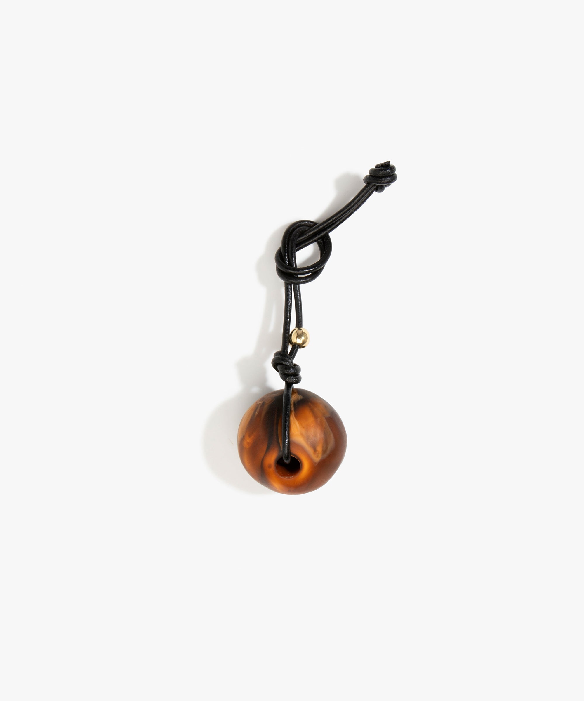 Dinosaur Designs Round Watercolour Bag Charm in Dark Horn Colour resin with Brass Material..