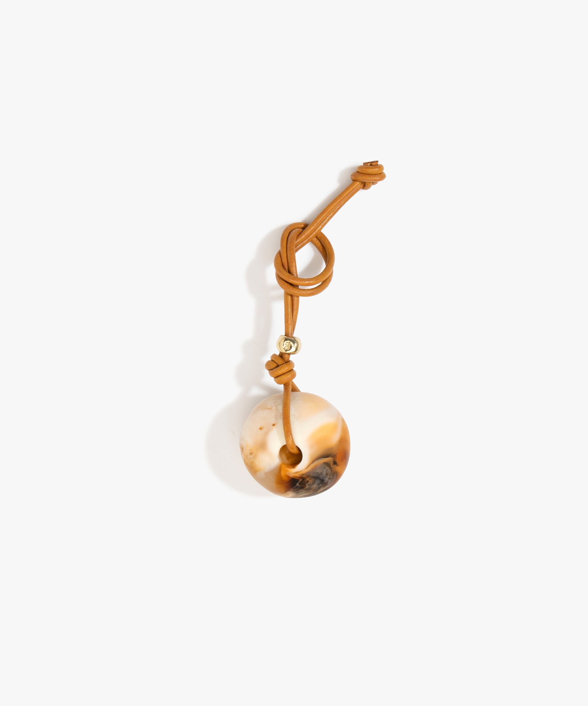 Dinosaur Designs Round Watercolour Bag Charm in Light Horn Colour resin with Brass Material..