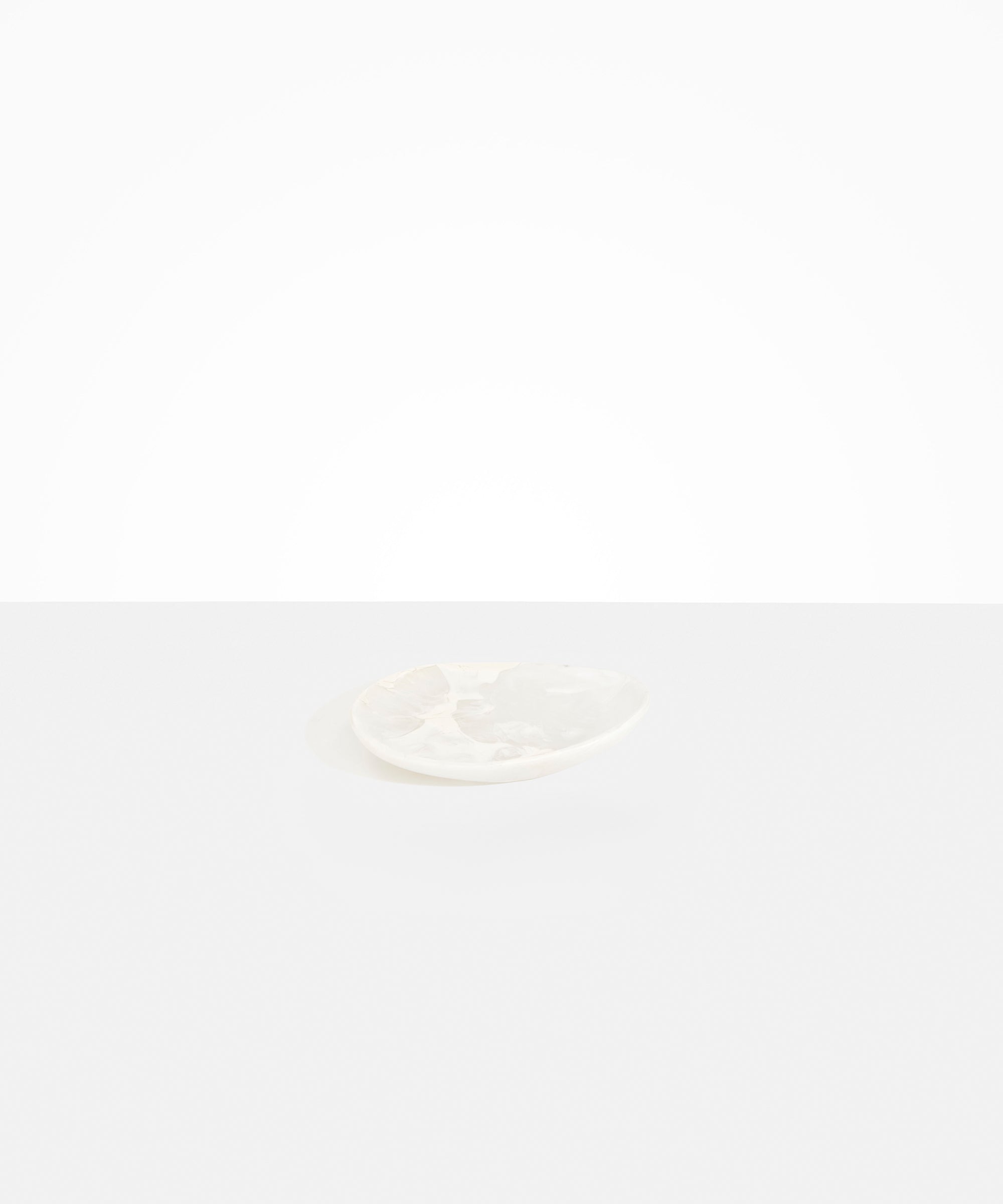 Dinosaur Designs Pebble Side Plate in Snow Swirl Colour resin.