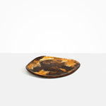 Dinosaur Designs Pebble Plate in Dark Horn Colour resin.