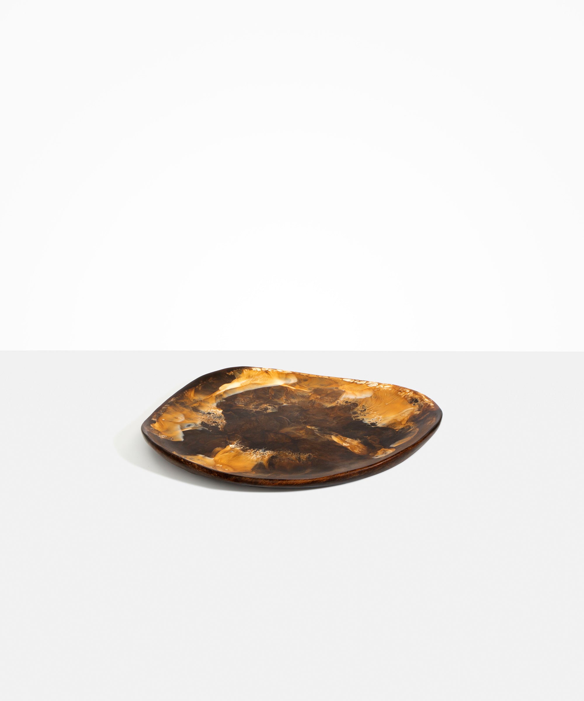 Dinosaur Designs Pebble Plate in Dark Horn Colour resin.