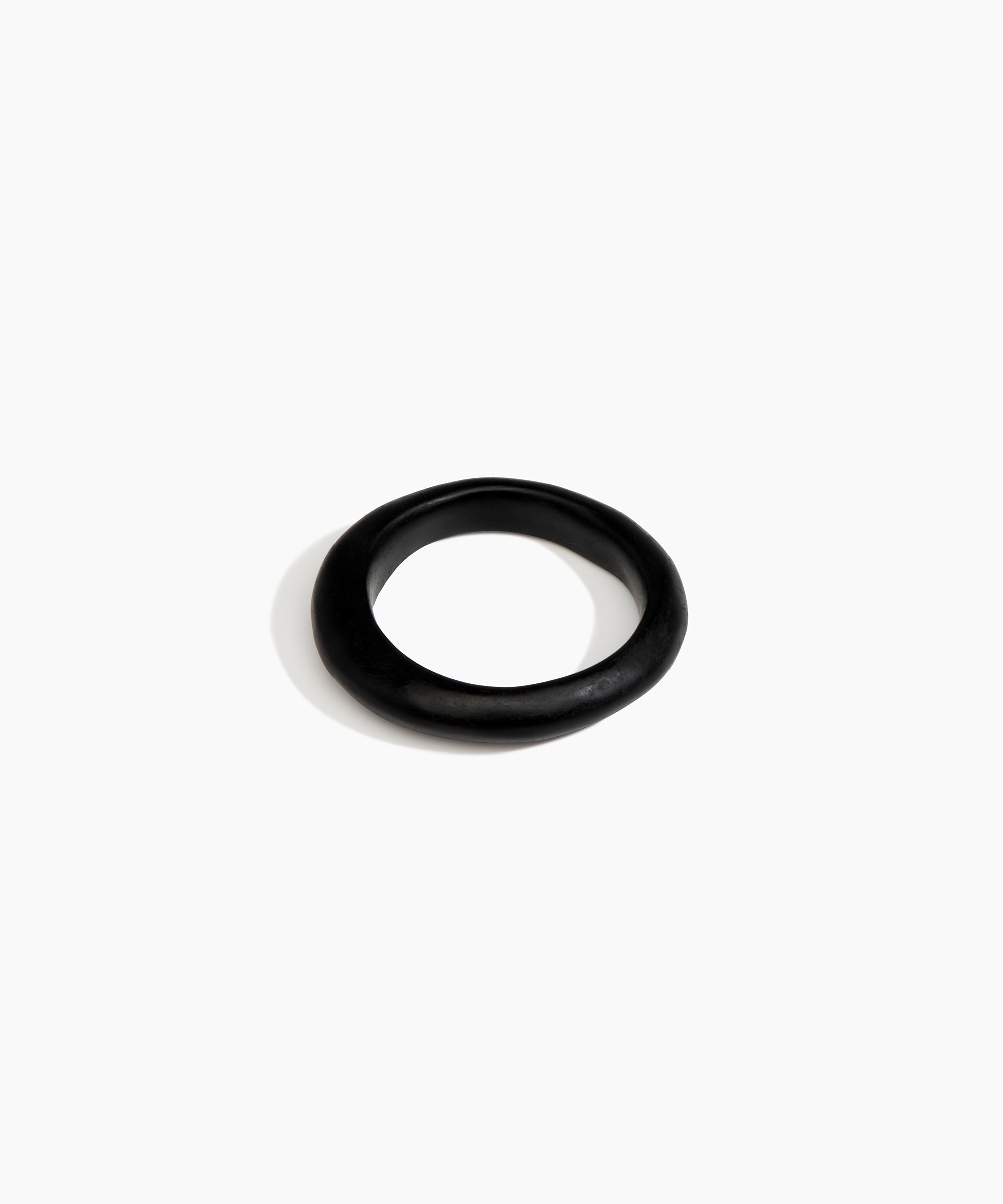 Dinosaur Designs Small Organic Bangle in Black Colour resin with Regular Fit.